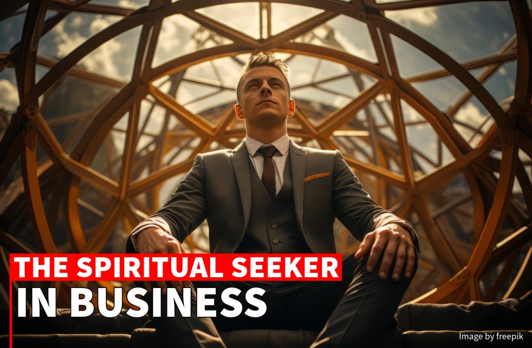 A confident businessman in a suit sits inside a modern geometric dome, under a cloudy sky, with text overlay "the spiritual seeker in business.